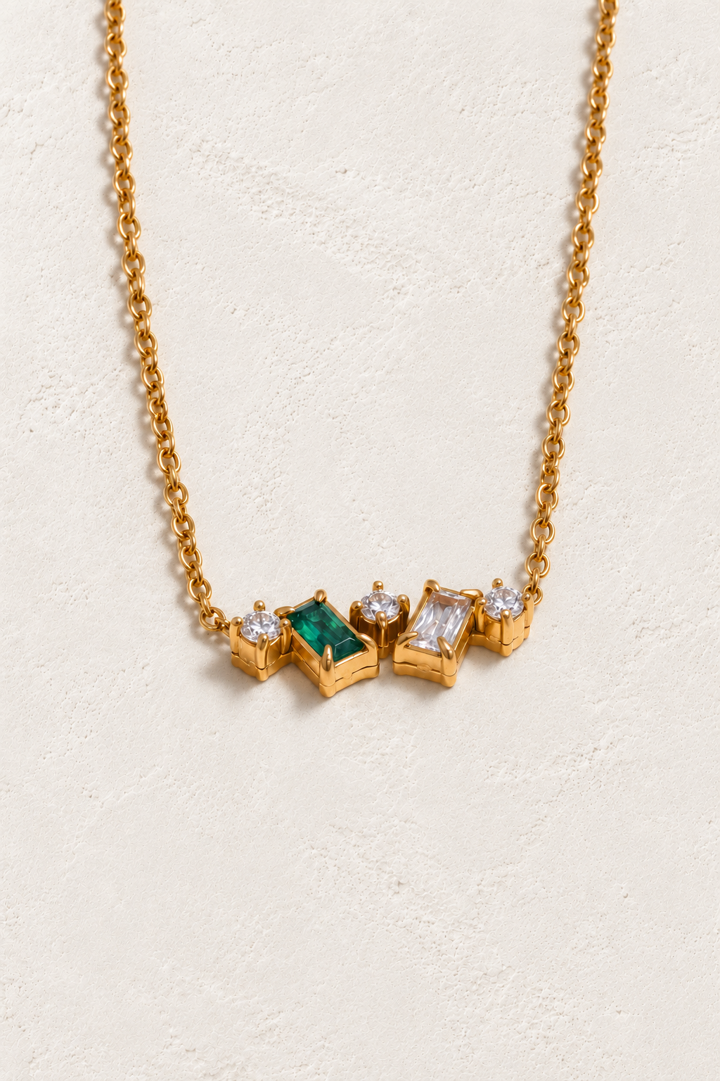 
                  
                    Green & Clear Zircon Cluster Necklace on approved cream hero background
                  
                
