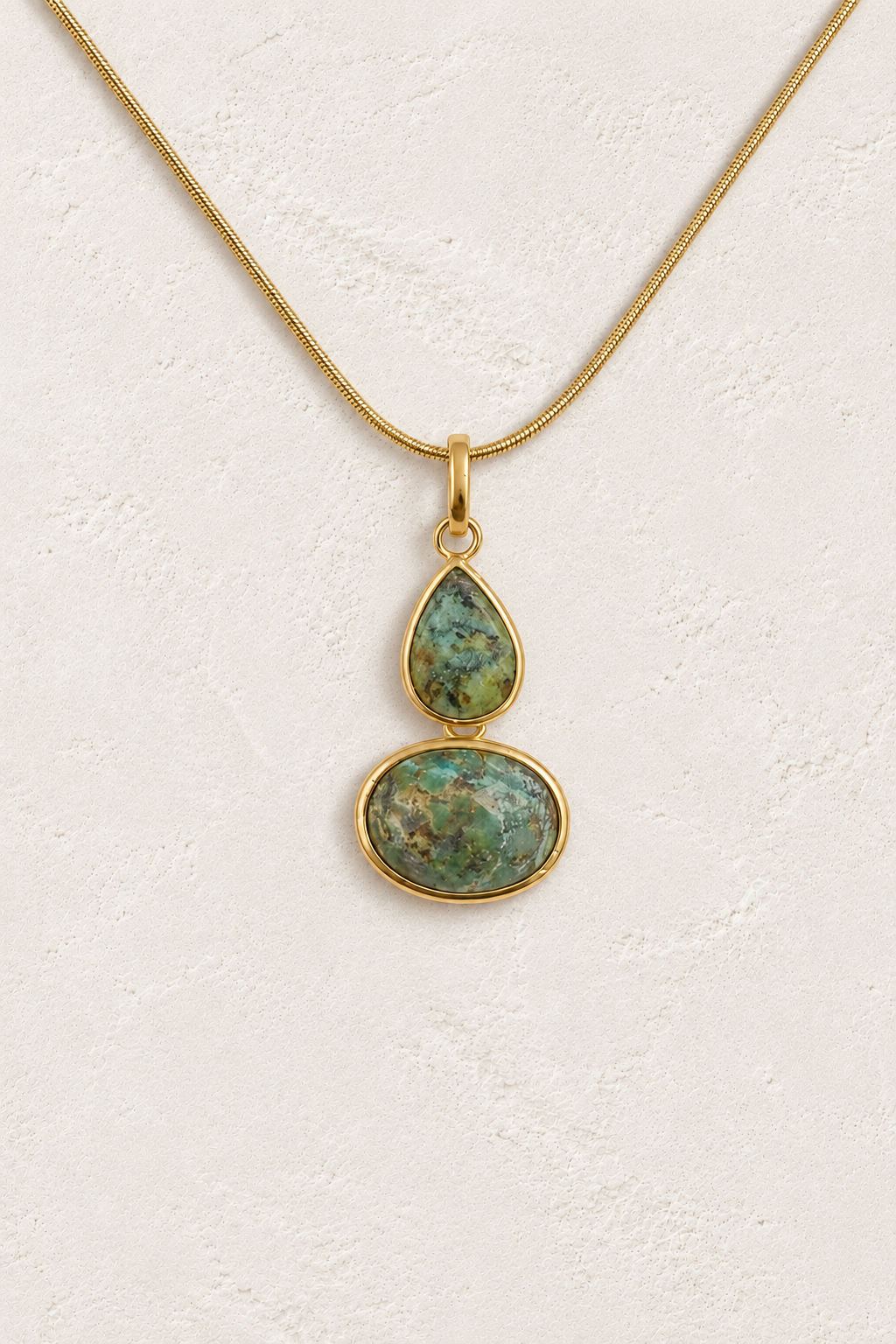 
                  
                    African Turquoise double stone necklace on approved cream hero background
                  
                