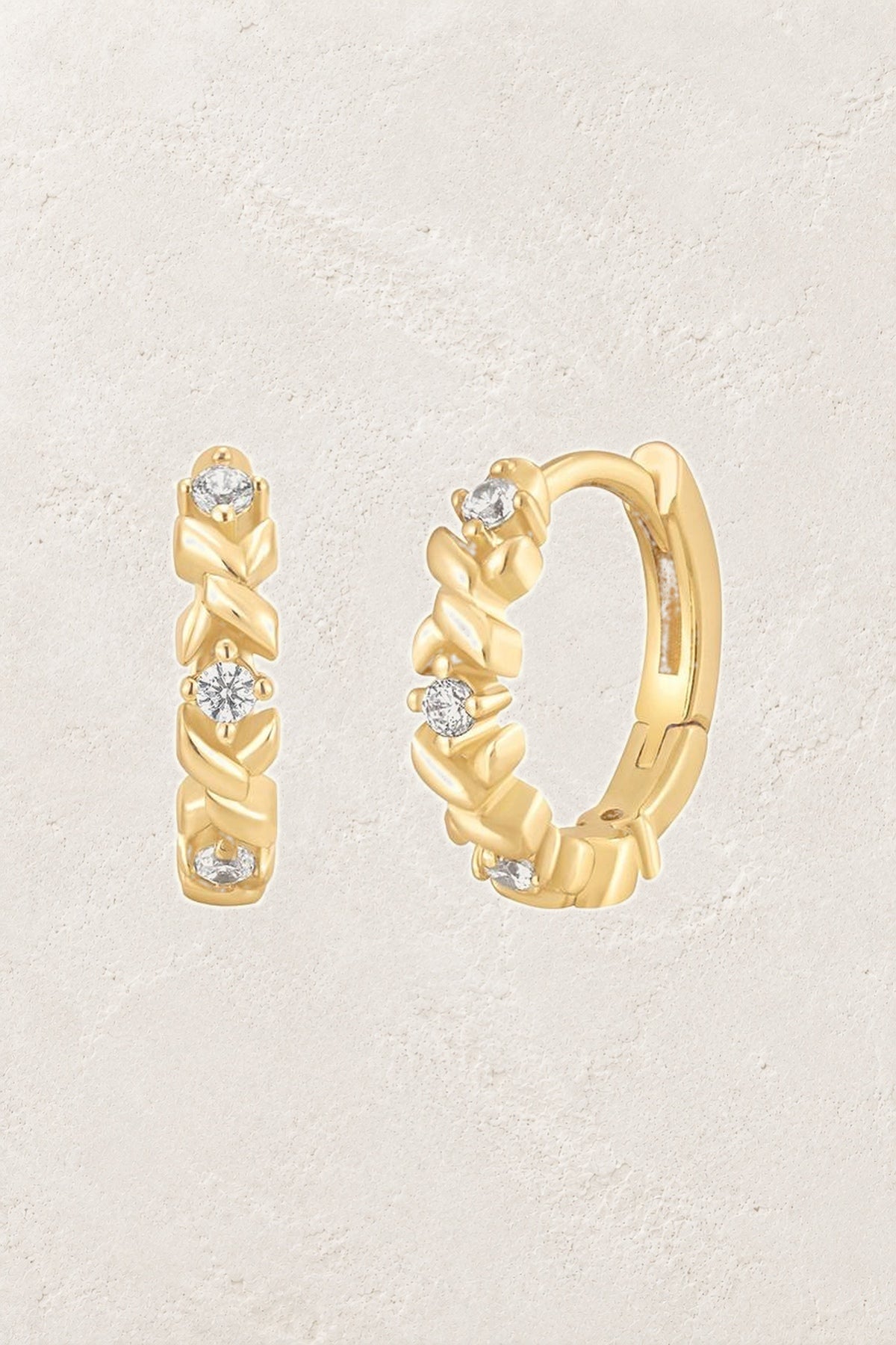 
                  
                    Aurelia Crystal Twist Huggie Earrings
                  
                