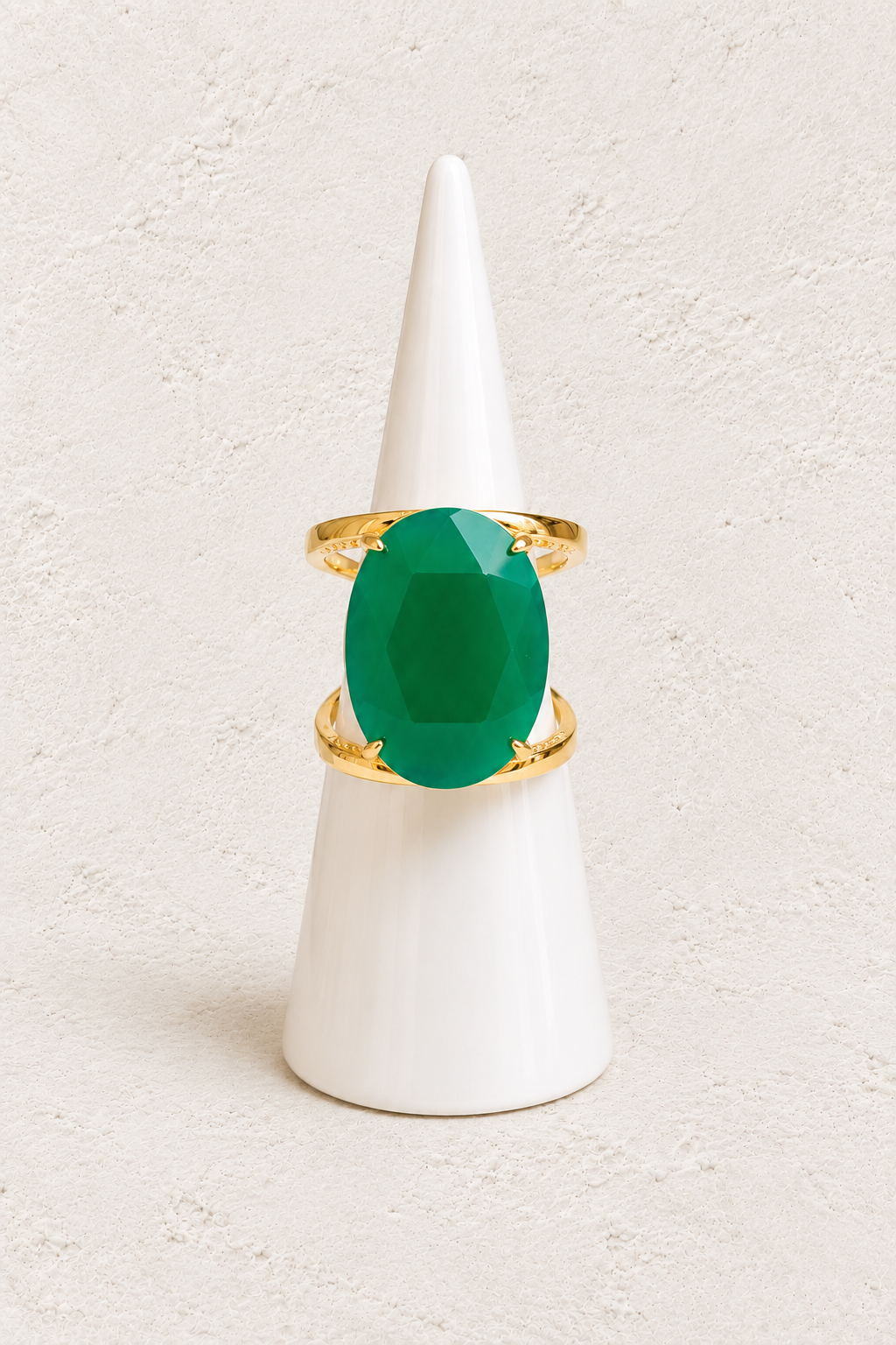 Aurevia Green Jade Statement Ring on white cone against warm textured background