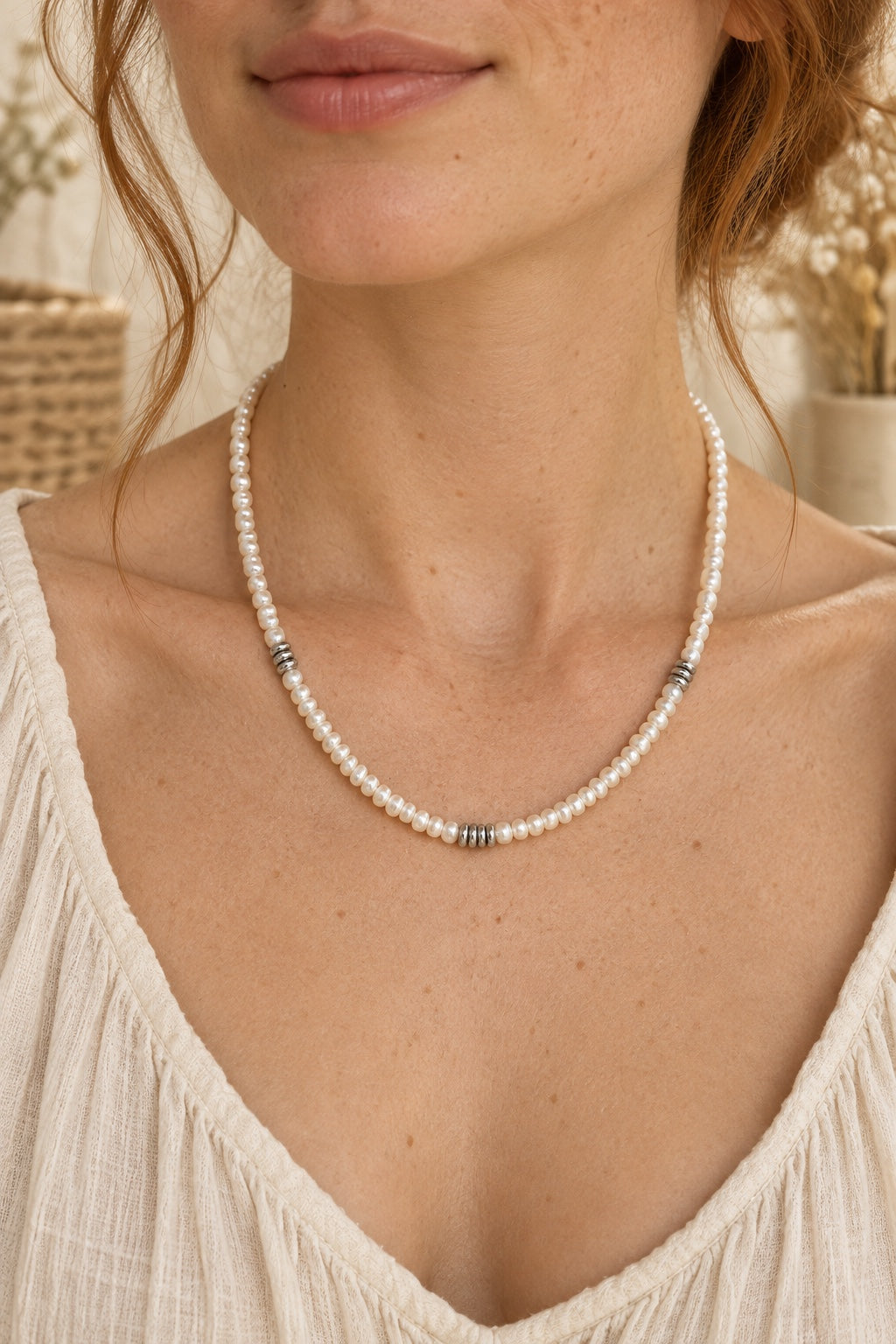 Model wearing the Avelisse pearl strand waterproof necklace
