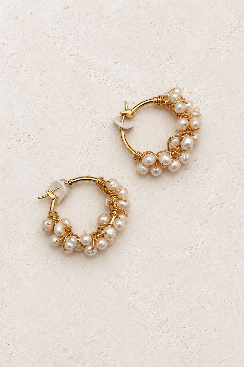 Bauble Pearl Hoop Earring on cream textured background