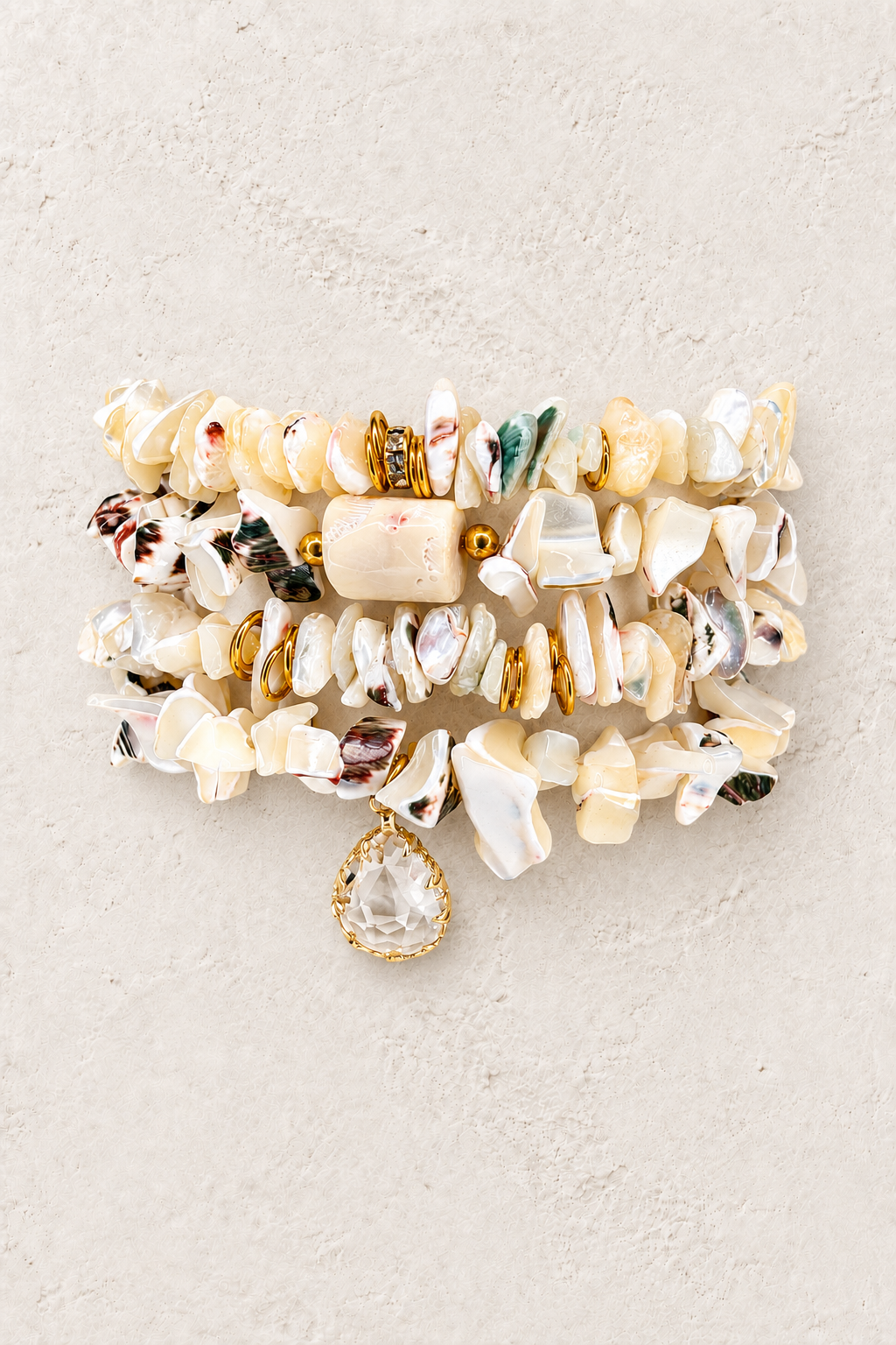 Beachcomber 4-piece elastic bracelet stack on warm textured background