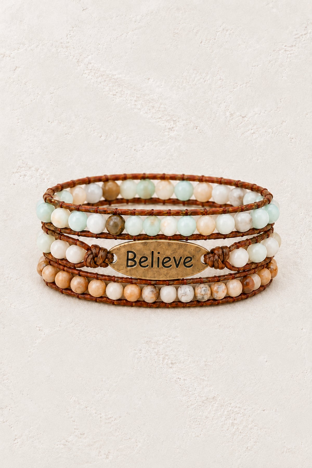 Believe Handmade Natural Stone Wrap Bracelet on the approved Boho & Mala ivory plaster background