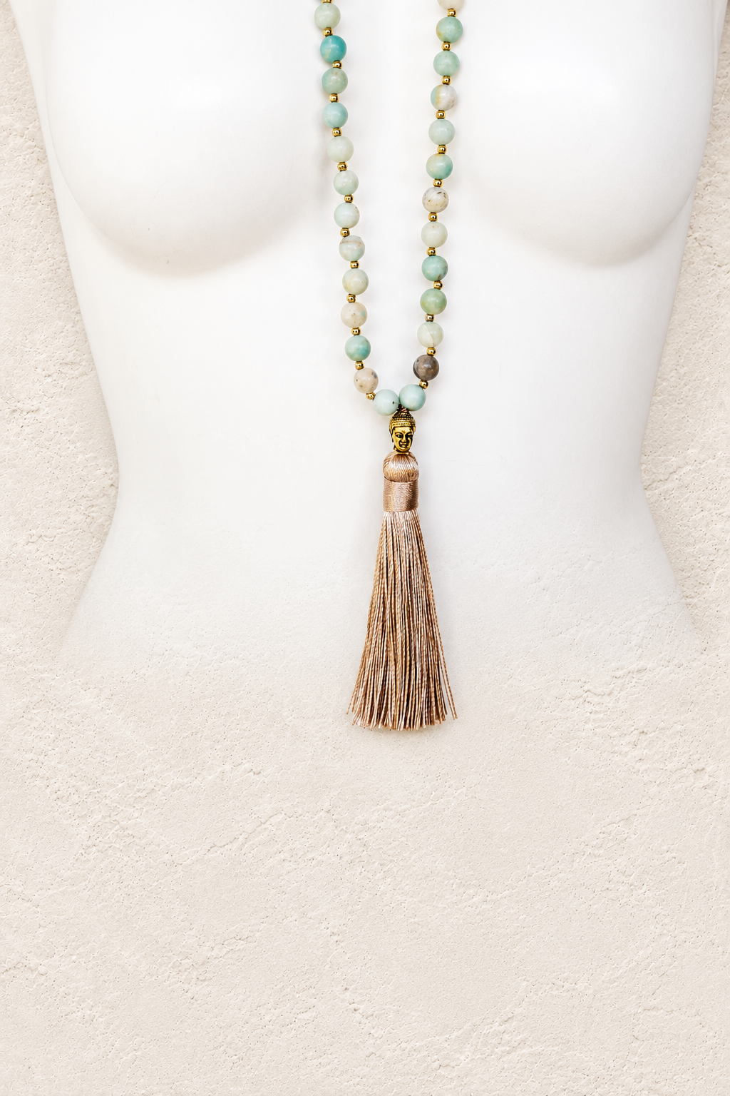 
                  
                    Blue Amazonite Gold Tribal Necklace on warm ivory plaster background
                  
                