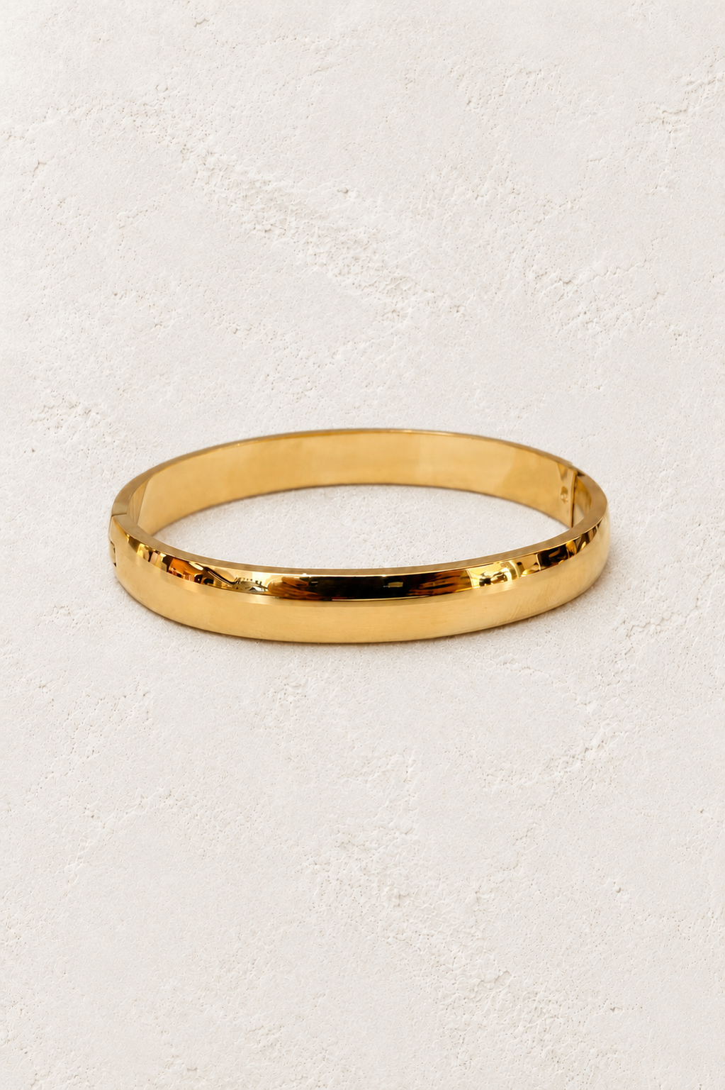 Marvelle Classic Rounded Gold Bangle on Francesca's supplied original hero background