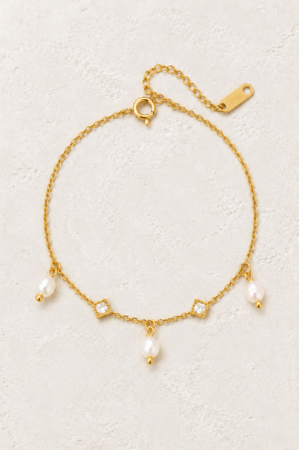 Mira Freshwater Pearl & Crystal Charm Bracelet on Francesca's supplied original hero background