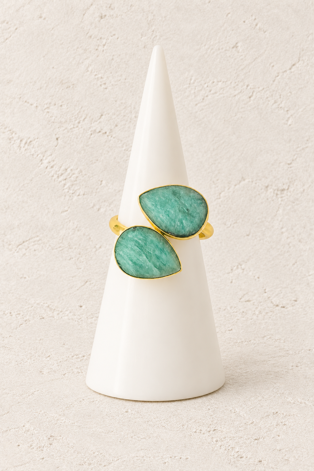 Boho & Mala Calming Amazonite Gold Ring (adjustable) on white cone against warm textured background