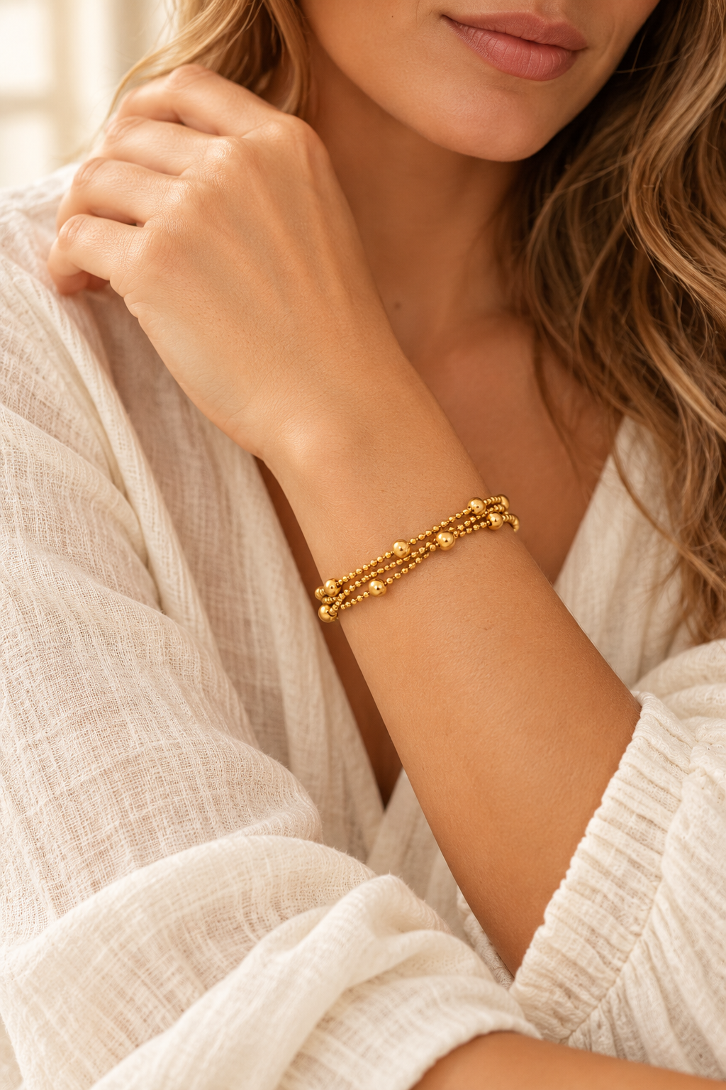 
                  
                    Boho model wearing the gold beaded bracelet
                  
                