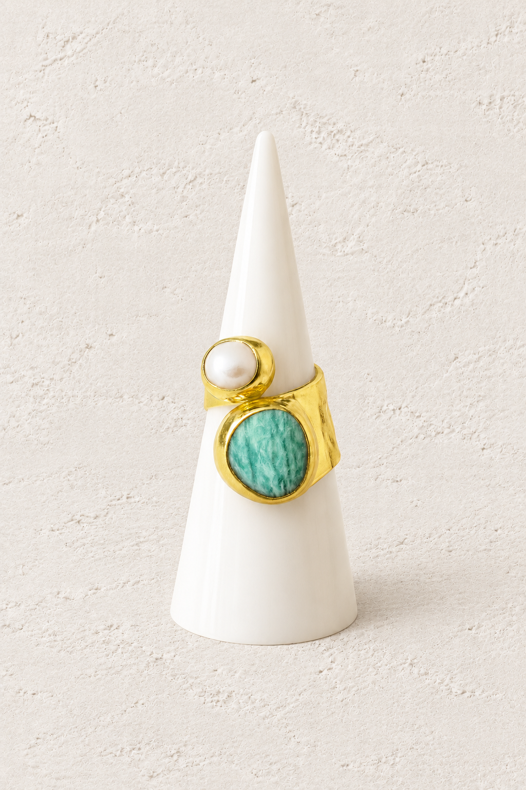 Boho & Mala Calming Amazonite & Freshwater Pearl Gold Ring (adjustable) on white cone against warm textured background
