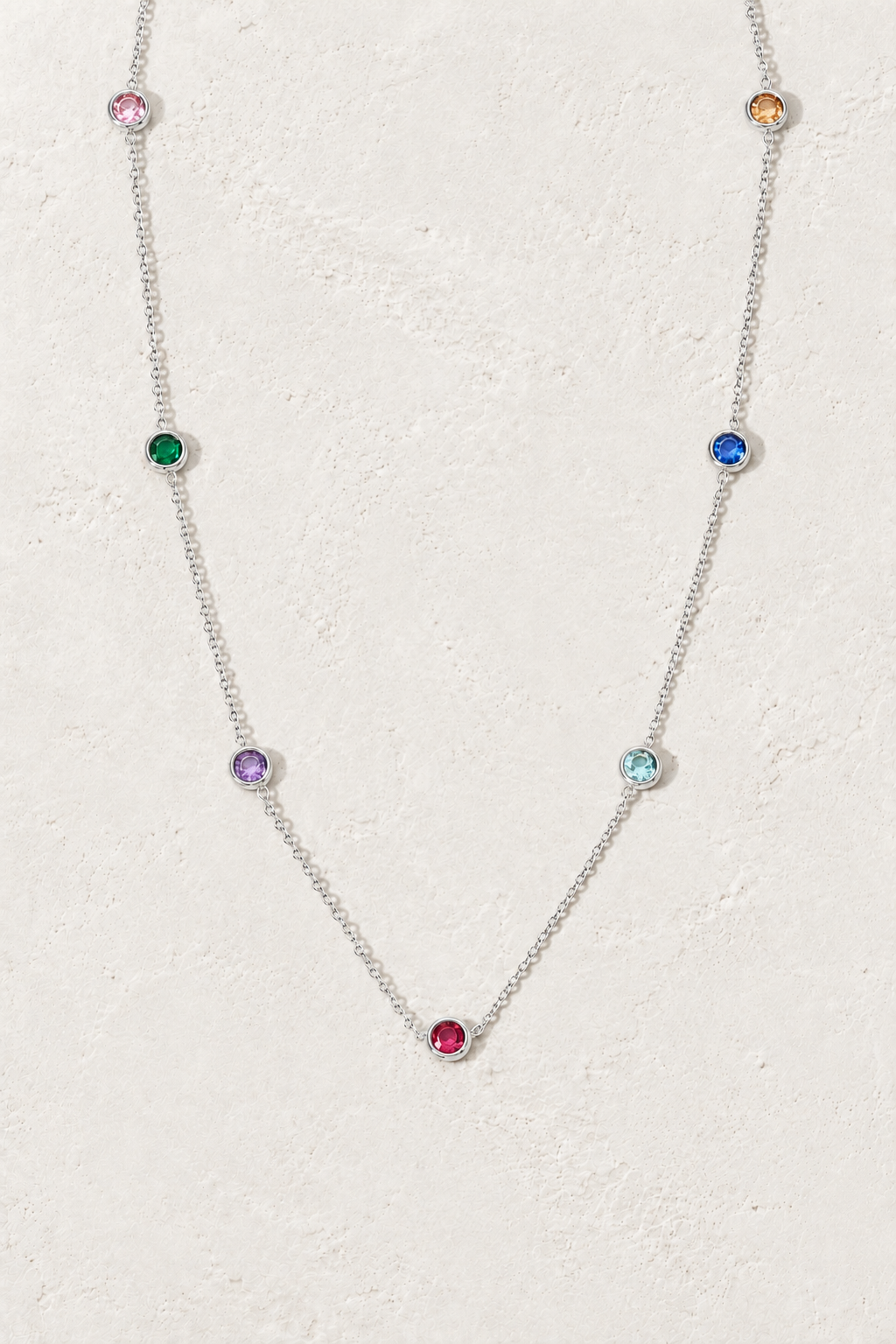 Colourful Pendant Necklace on the Boho & Mala cream stone hero background