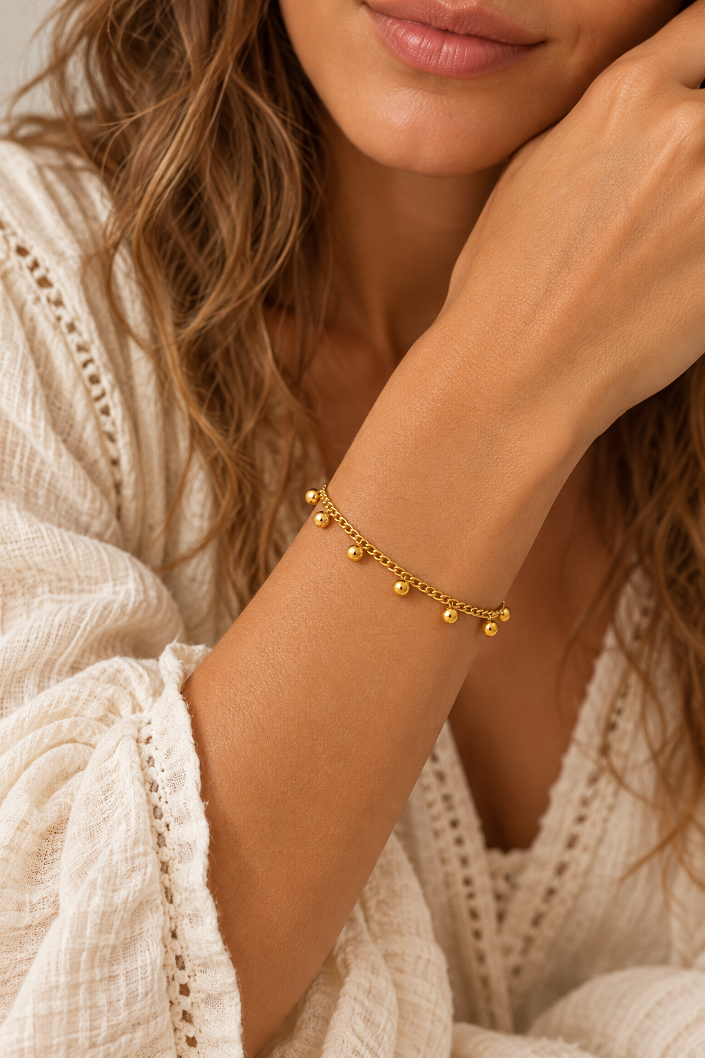 
                  
                    Gold Dangle Bead Bracelet on boho model
                  
                