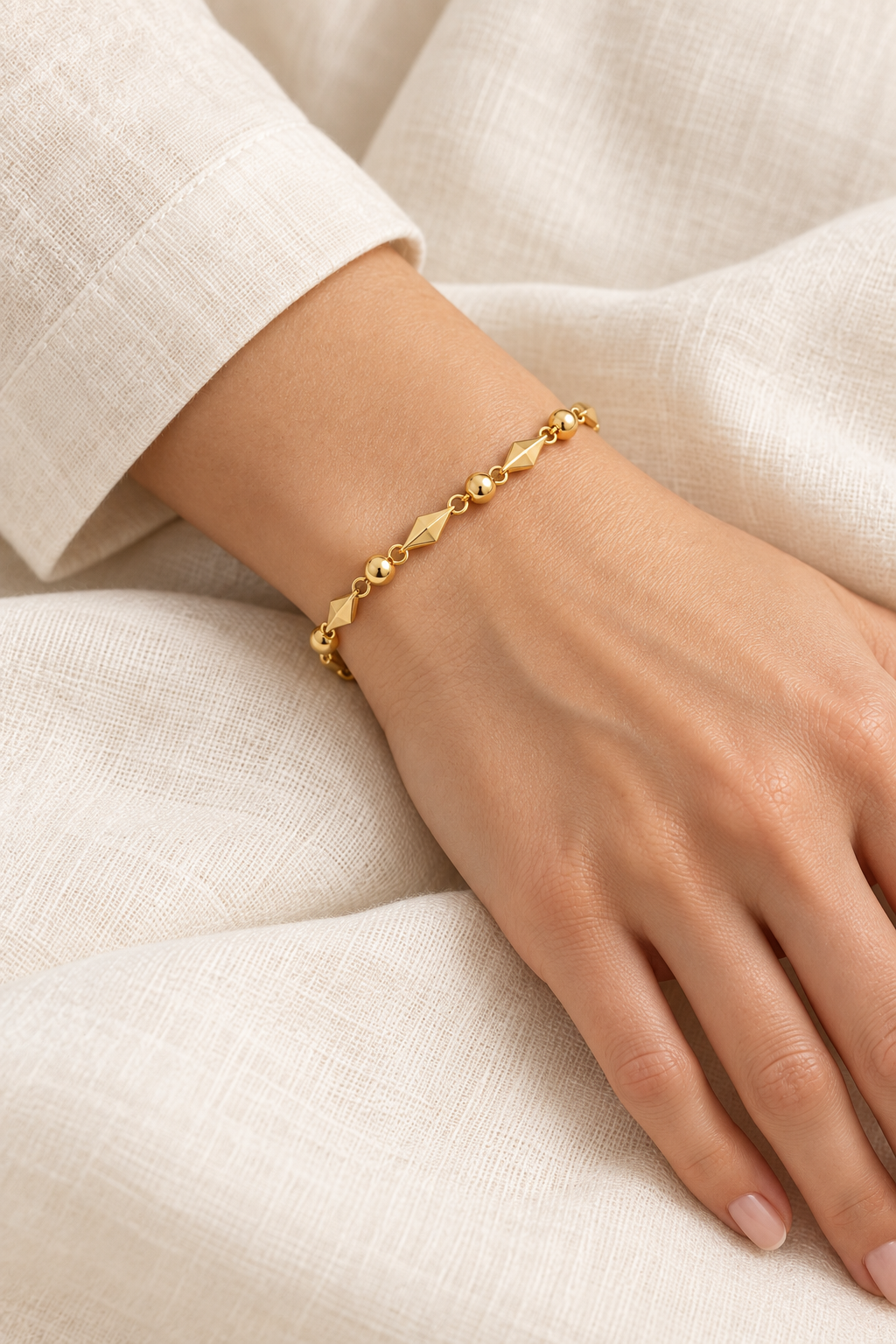 
                  
                    Gold Diamond & Bead Bracelet on boho model
                  
                