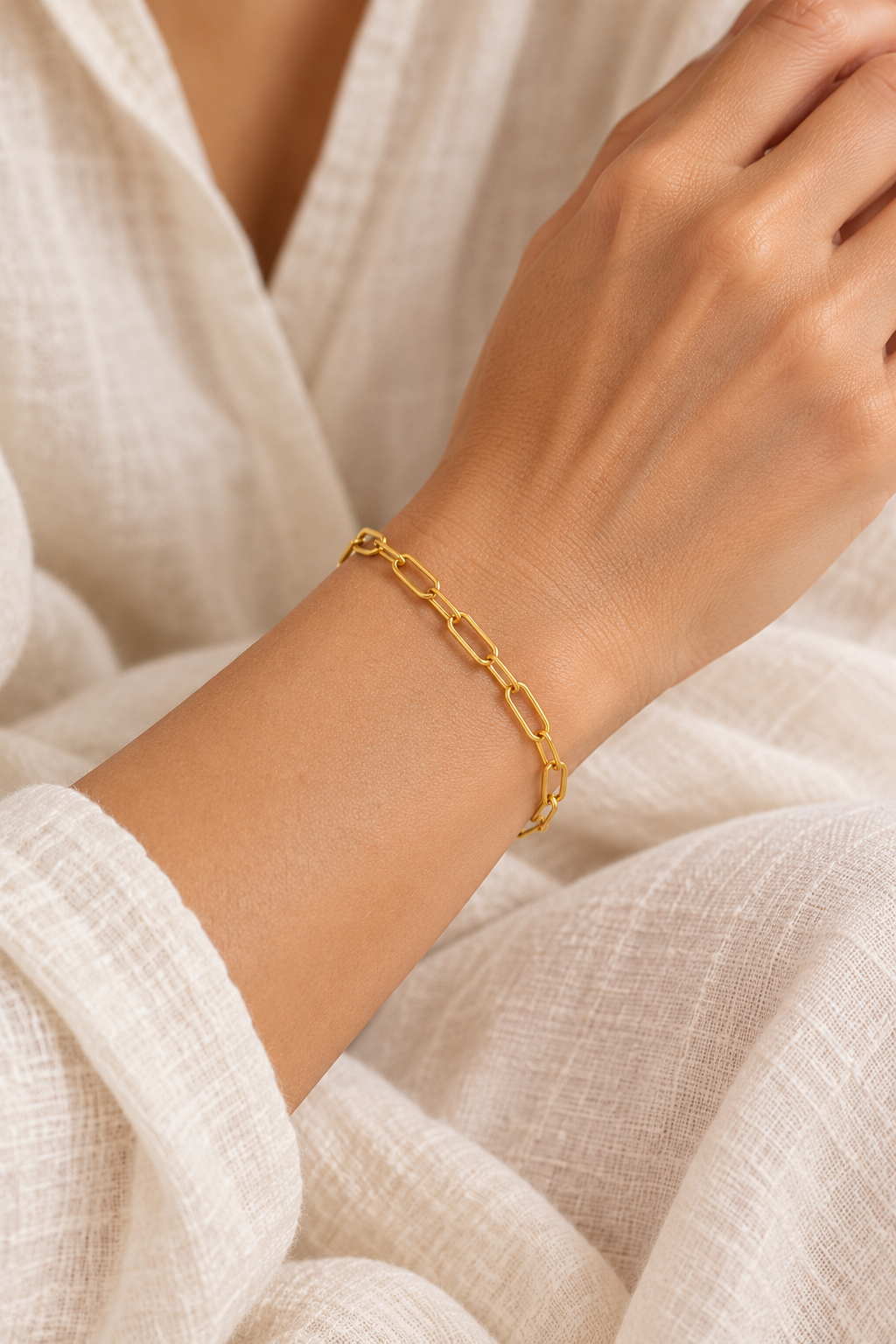 
                  
                    Boho model wearing the gold finepaperclip bracelet
                  
                
