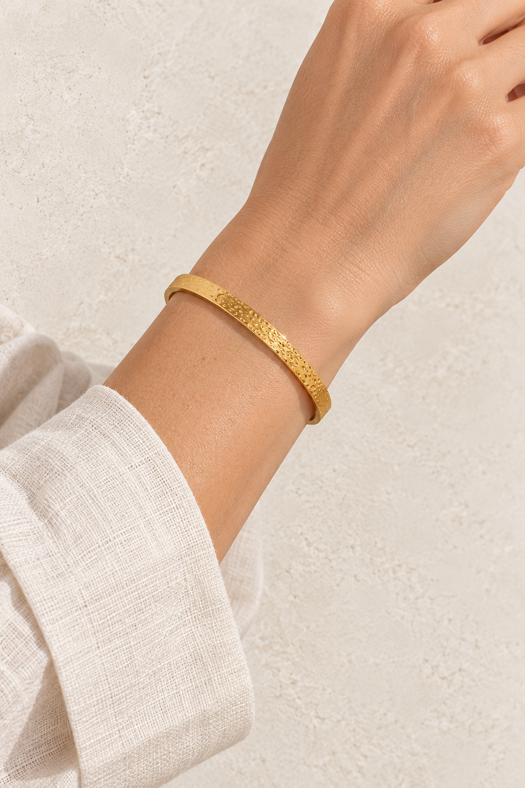 
                  
                    Model wearing Classic Textured Gold Cuff
                  
                