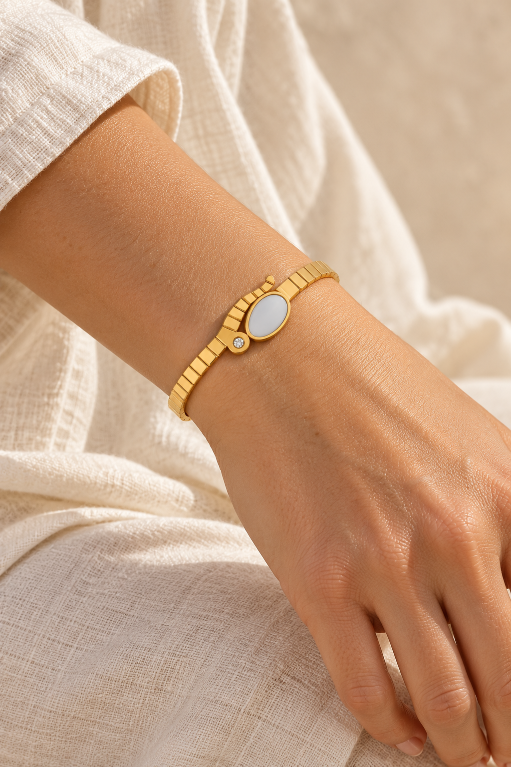 
                  
                    Boho & Mala Gold Cuff Bracelet worn on a model's wrist
                  
                