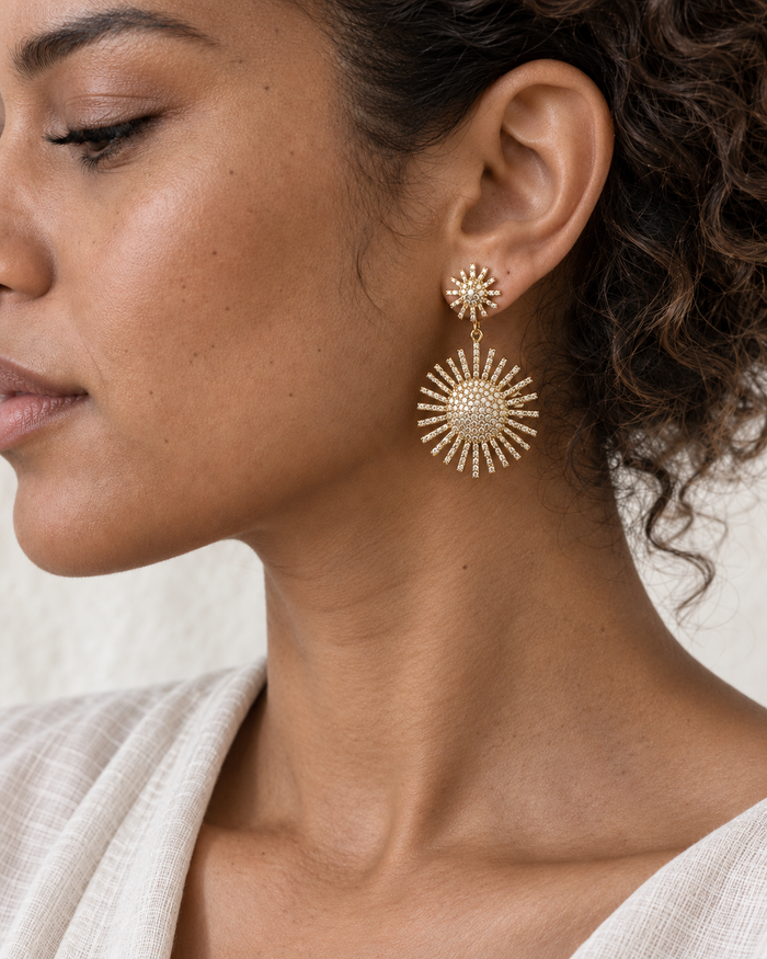 Model wearing Boho & Mala Elysia Gold Crystal Stud Drop Earrings – Sparkling Statement Earrings in natural daylight