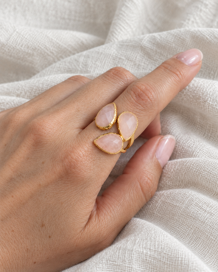 Model wearing Boho & Mala Seraphine Rose Quartz Ring in natural daylight