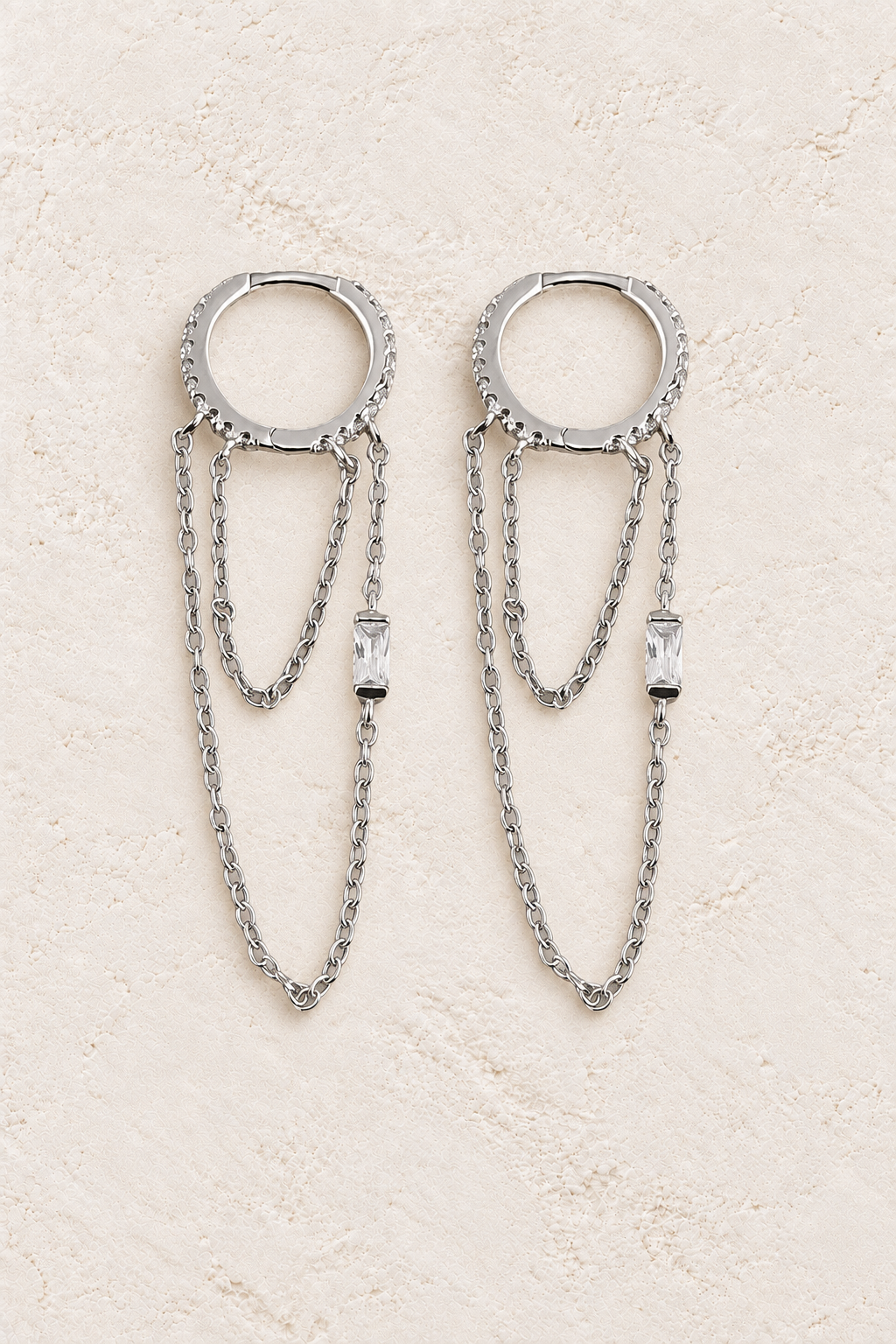 
                  
                    Boho & Mala Huggies Sterling Silver Hoop Earrings DE100065 on warm cream textured background
                  
                