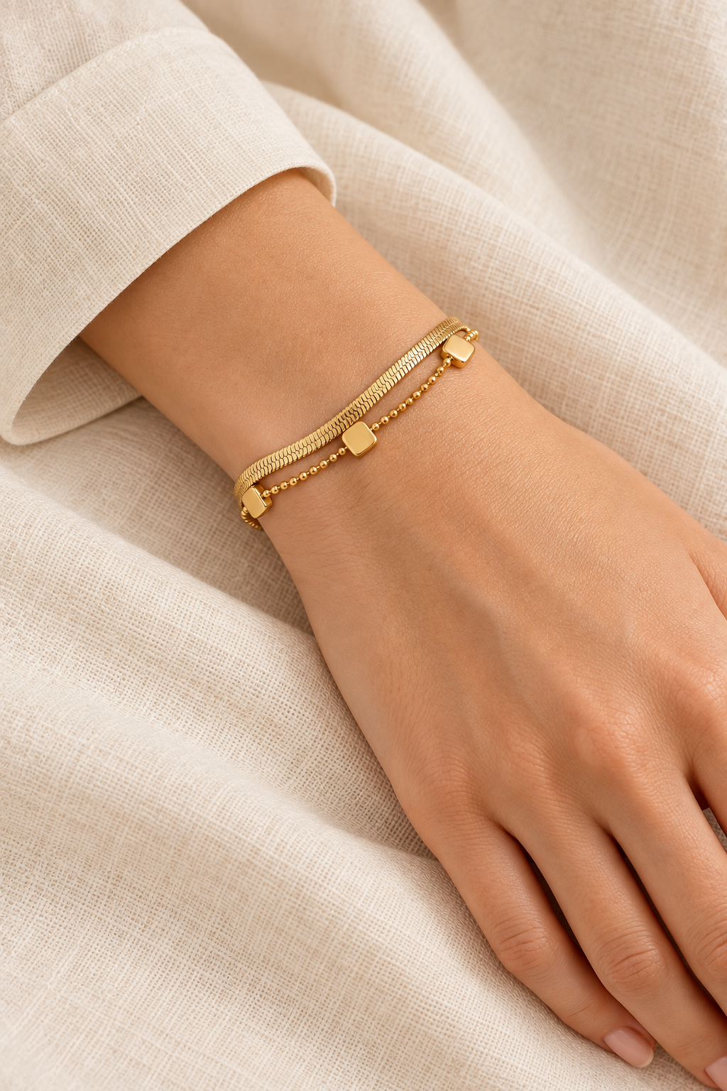 
                  
                    Gold Layered Square Charm Bracelet on boho model
                  
                