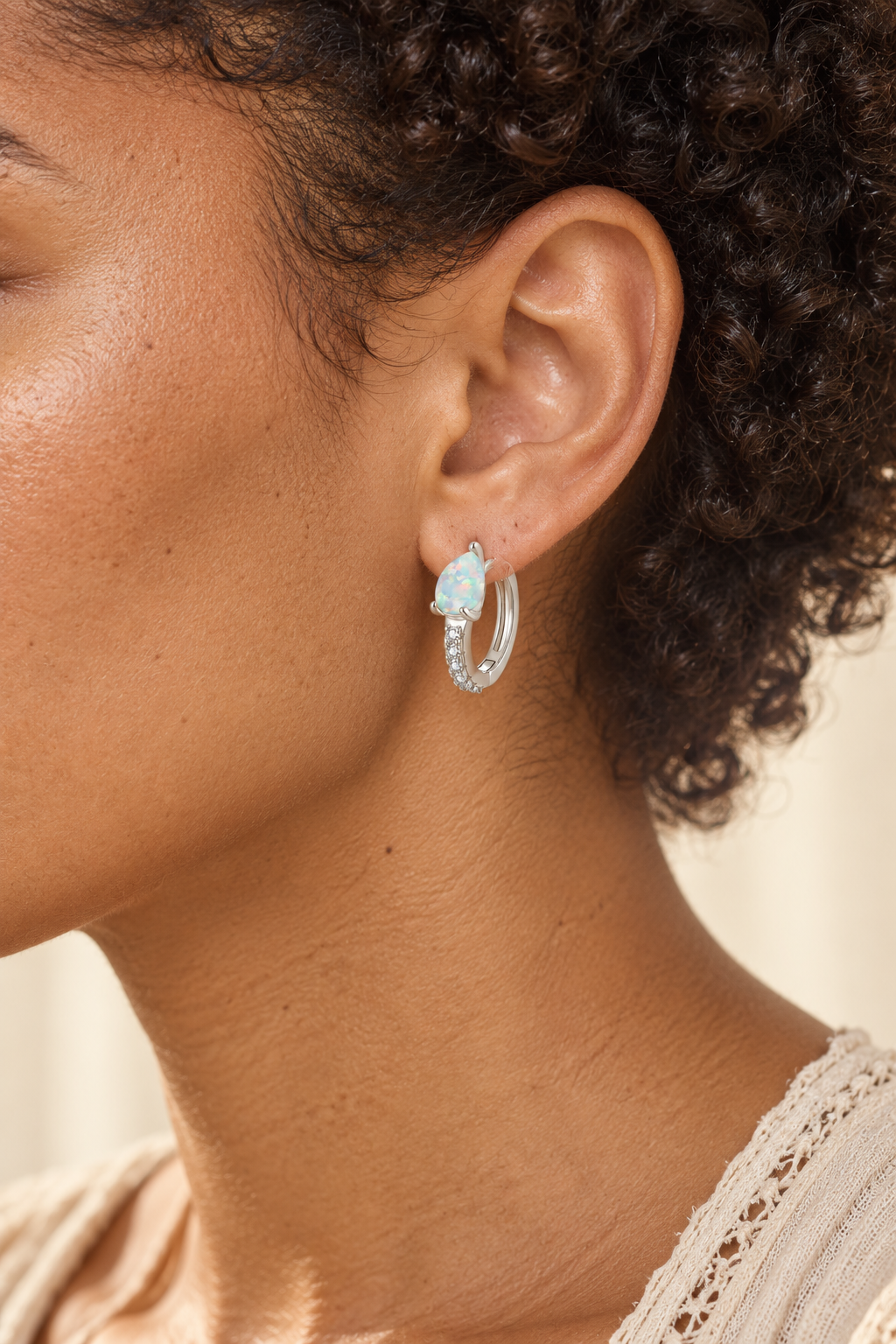 Model wearing Boho & Mala Opal Huggies Sterling Silver Hoop Earrings