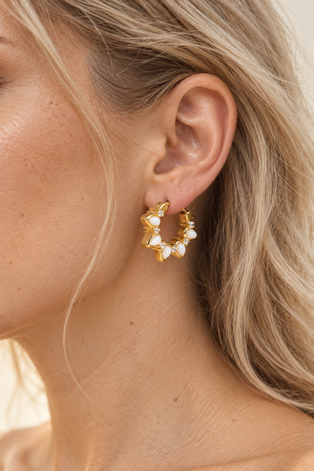 Model wearing Opal Star Huggie Earrings – 18K Gold Plated Sterling Silver