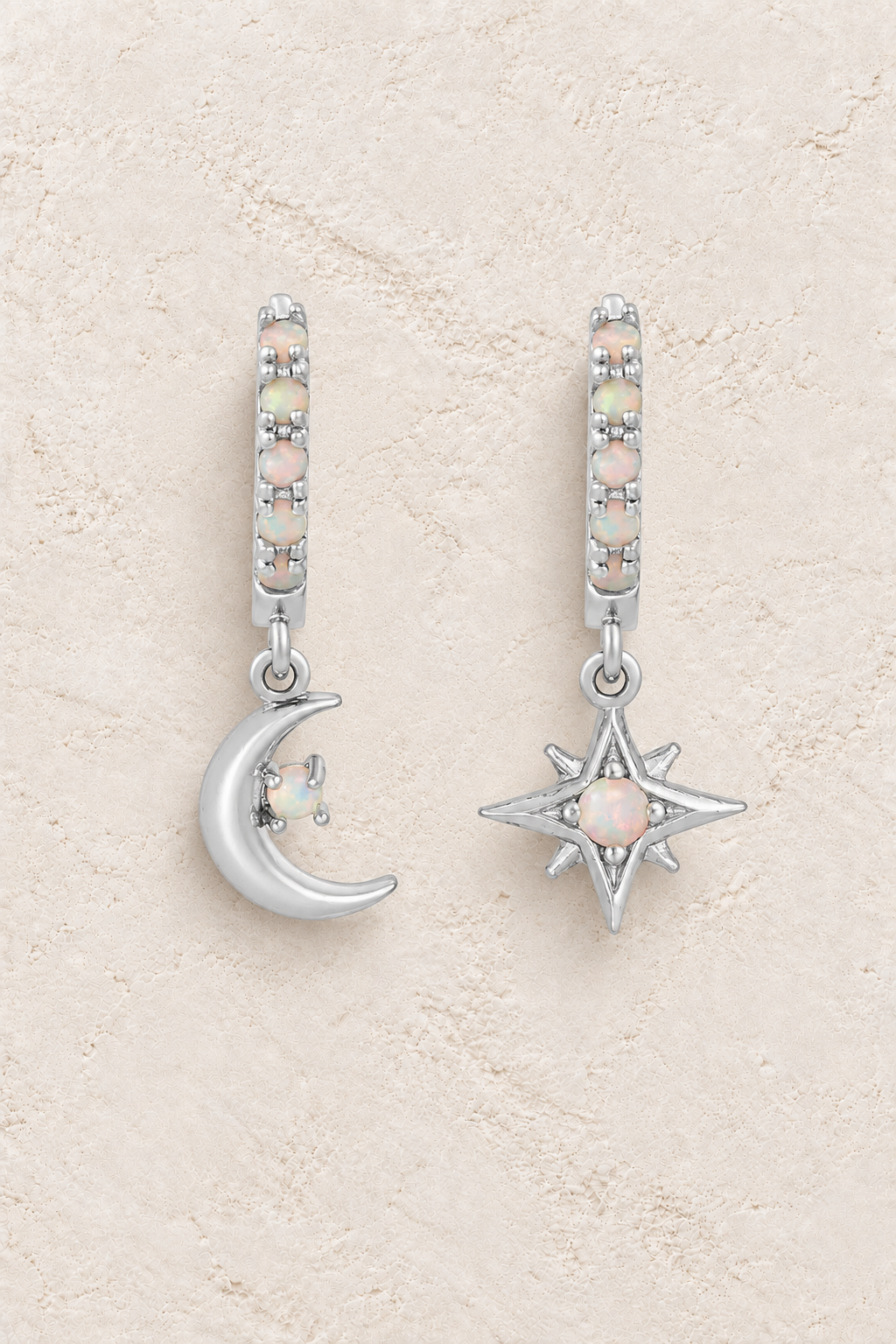 Boho & Mala Opal Star & Moon Sterling Silver Hoop Huggie Earrings on warm cream textured background