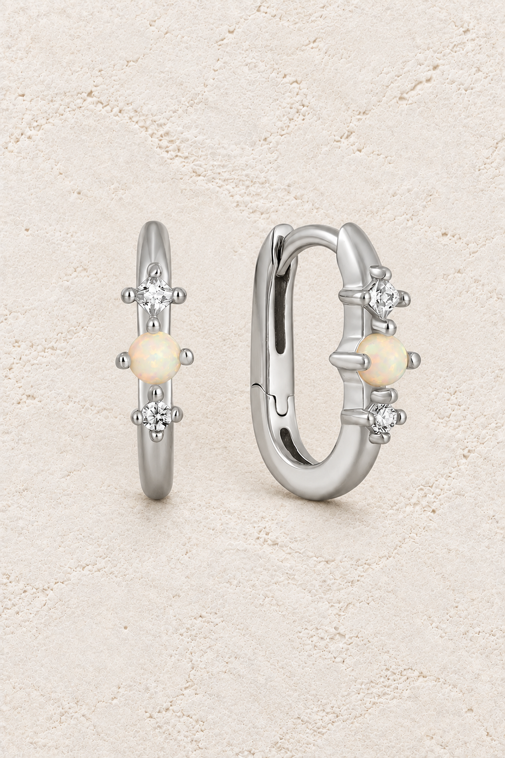 Boho & Mala Opal Sterling Silver Hoop Huggie Earrings on warm cream textured background