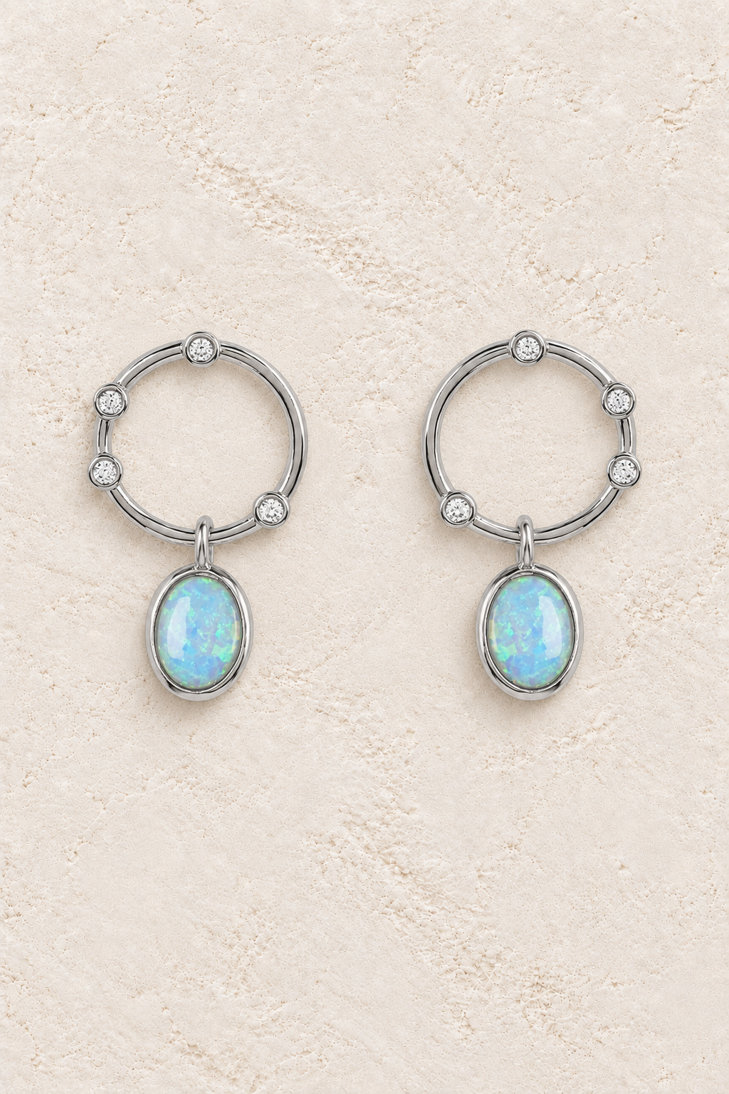 Boho & Mala Opal Sterling Silver Stud Earrings on warm cream textured background