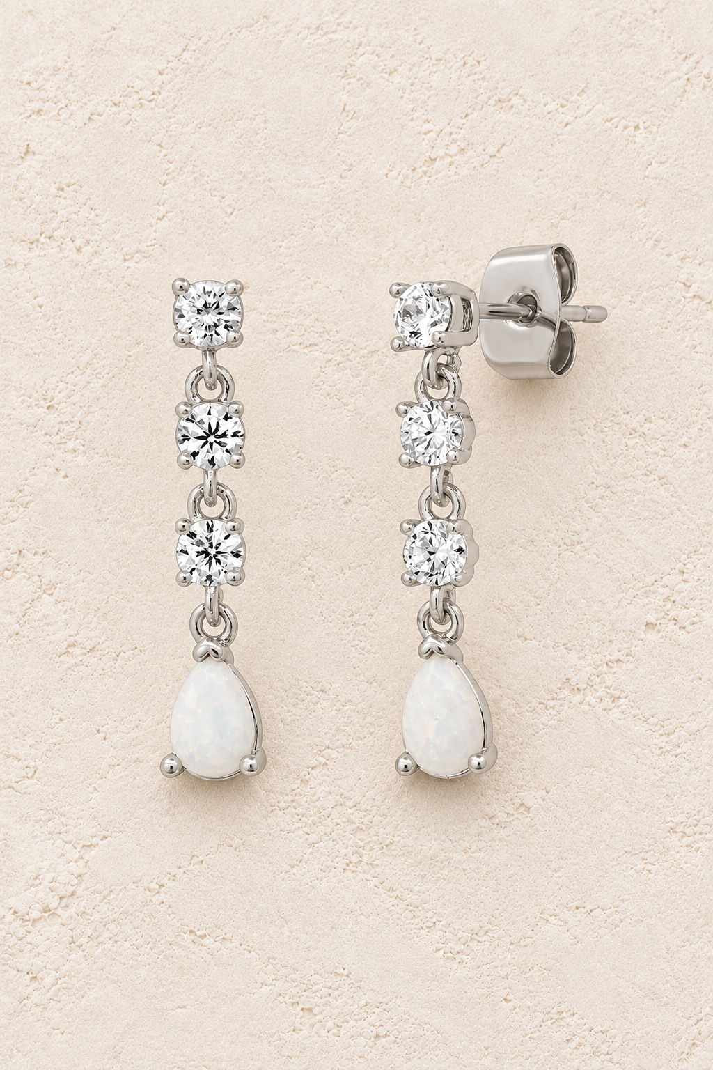 Boho & Mala Opal Sterling Silver Stud Earrings on warm cream textured background