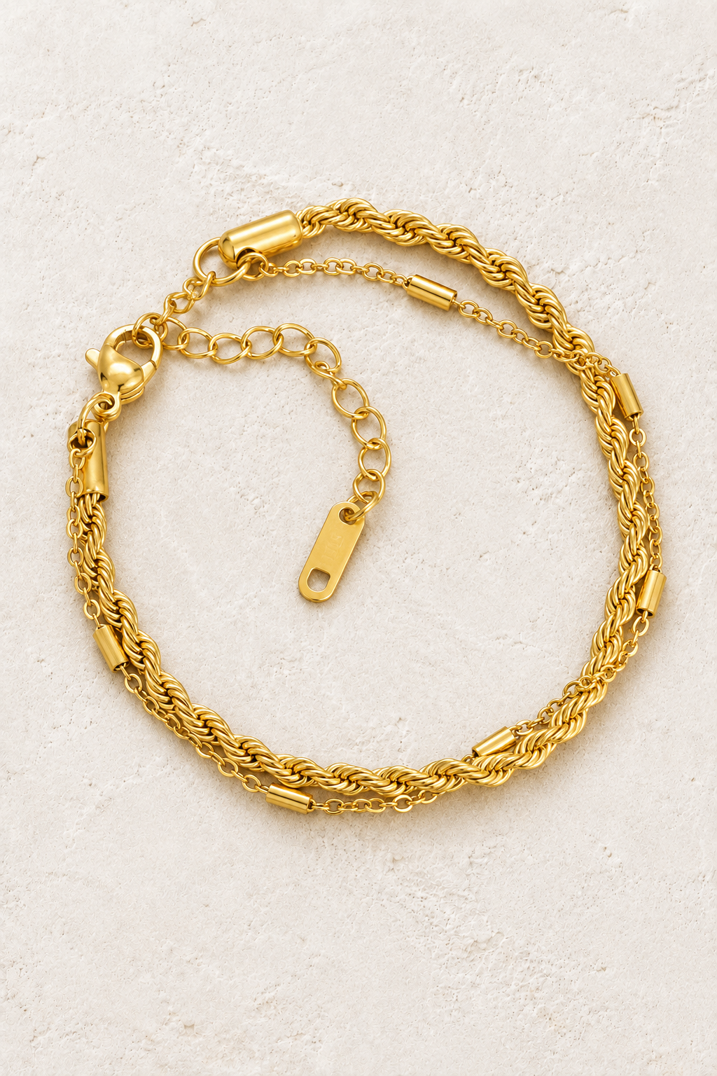 
                  
                    Gold Rope Layered Bracelet on ivory stone
                  
                