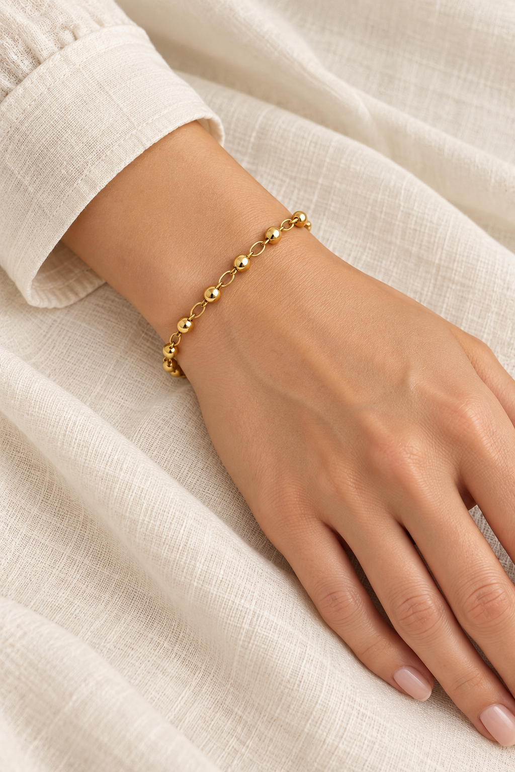 
                  
                    Gold Spaced Bead Bracelet on boho model
                  
                