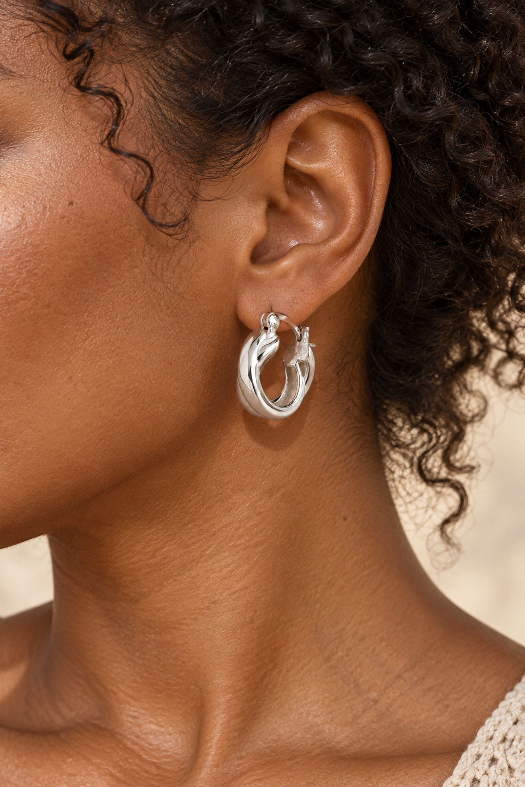 Model wearing Boho & Mala Sterling Silver Hoop Huggie Earrings