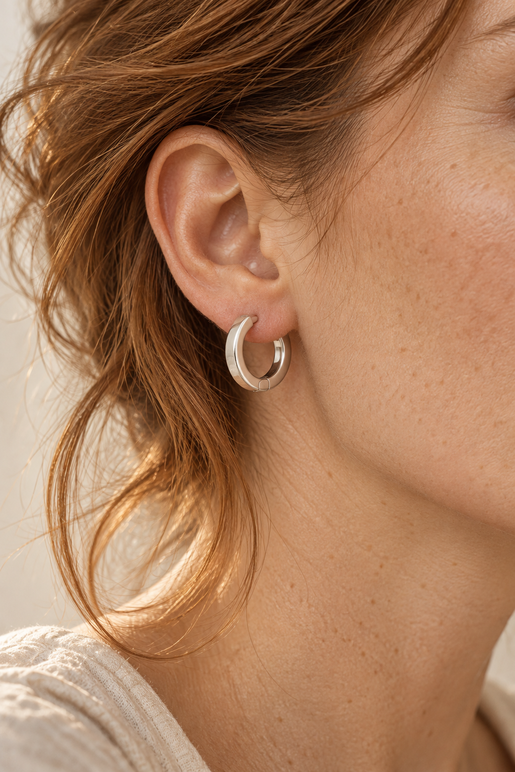 Model wearing Boho & Mala Sterling Silver Hoop Huggie Earrings
