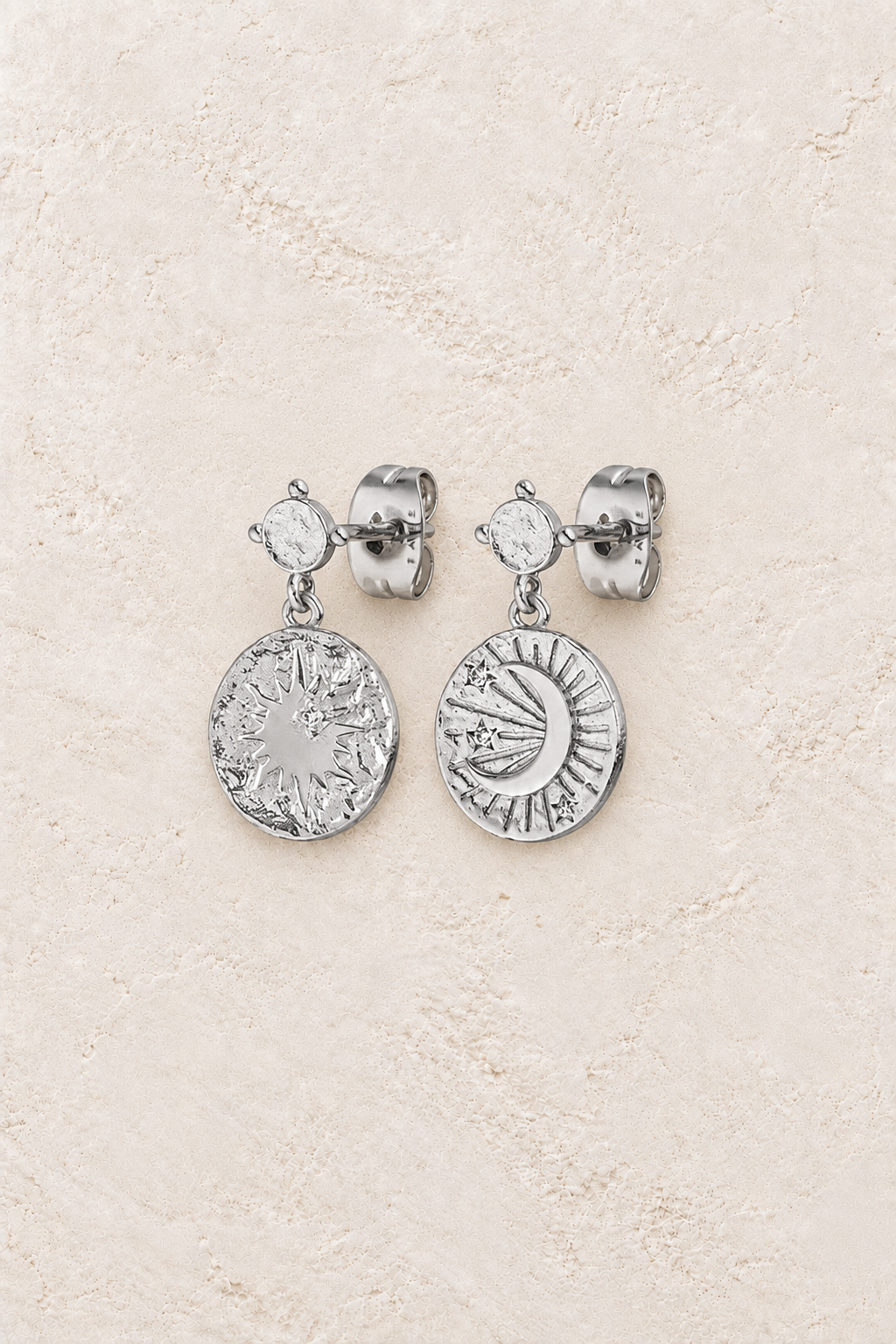 Boho & Mala Sterling Silver Stud Earrings on warm cream textured background