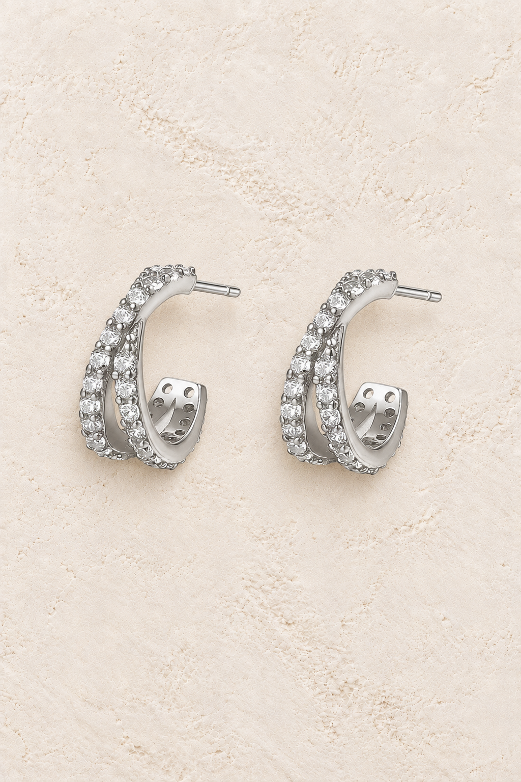Boho & Mala Sterling Silver Stud Hoop Earrings on warm cream textured background