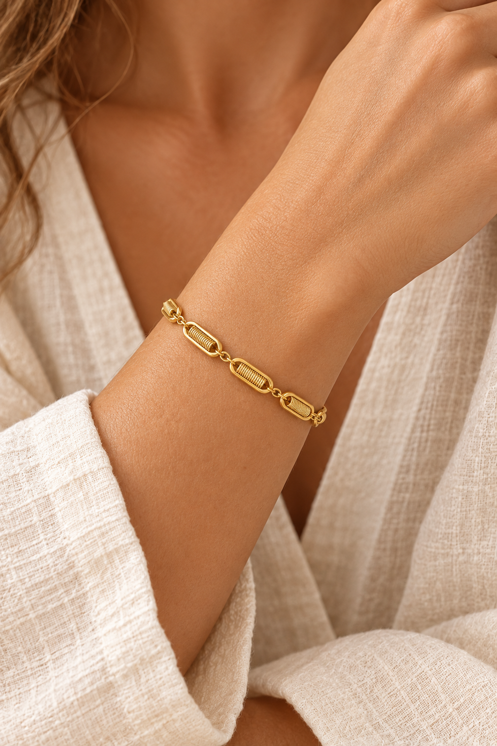 
                  
                    Boho model wearing the gold textured-link bracelet
                  
                