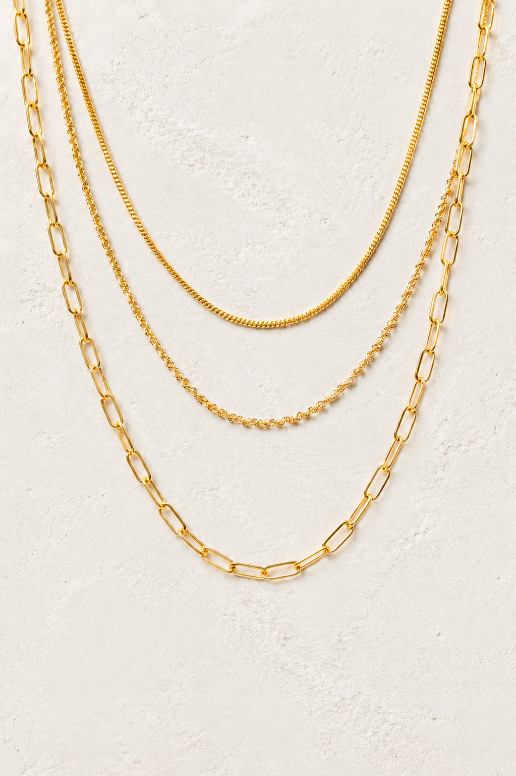 Sorrento Triple Layer Chain Necklace on the Boho & Mala cream stone hero background