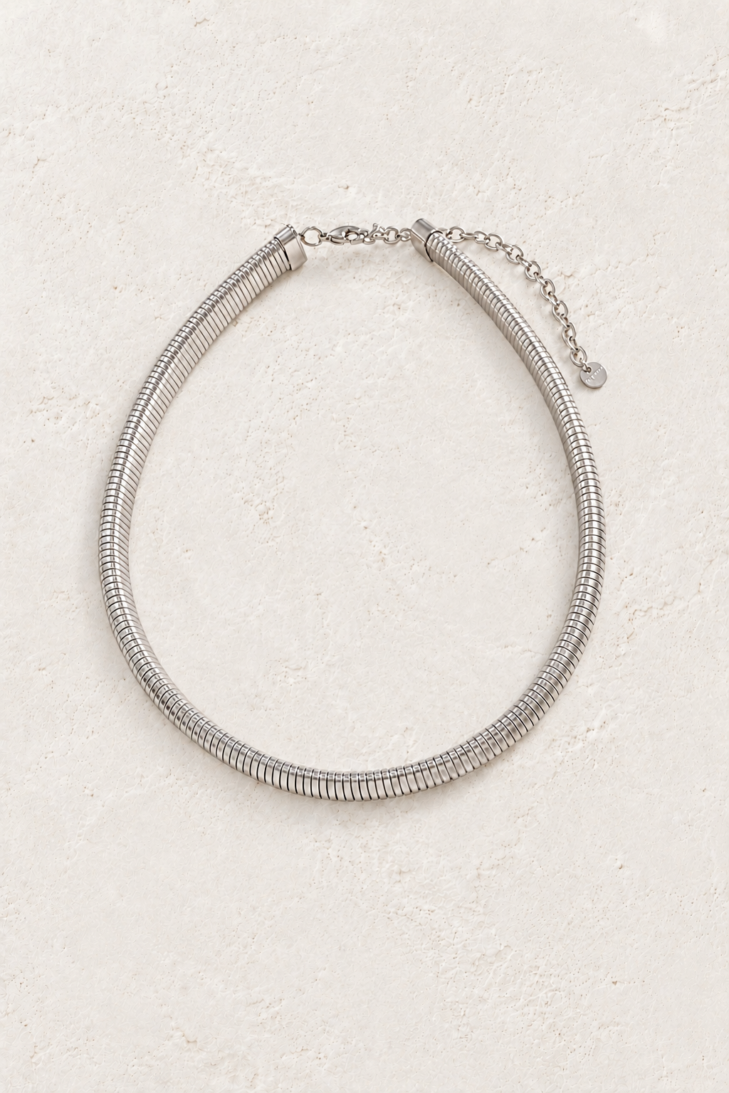 Soleil Silver Snake Chain Necklace on the Boho & Mala cream stone hero background