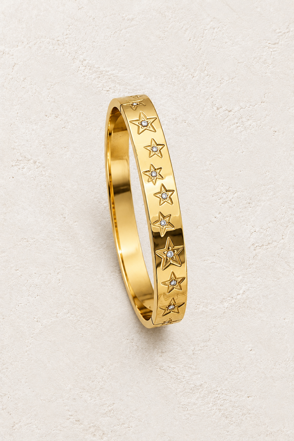 
                  
                    Gold Star Crystal Bangle | Waterproof on ivory textured background
                  
                