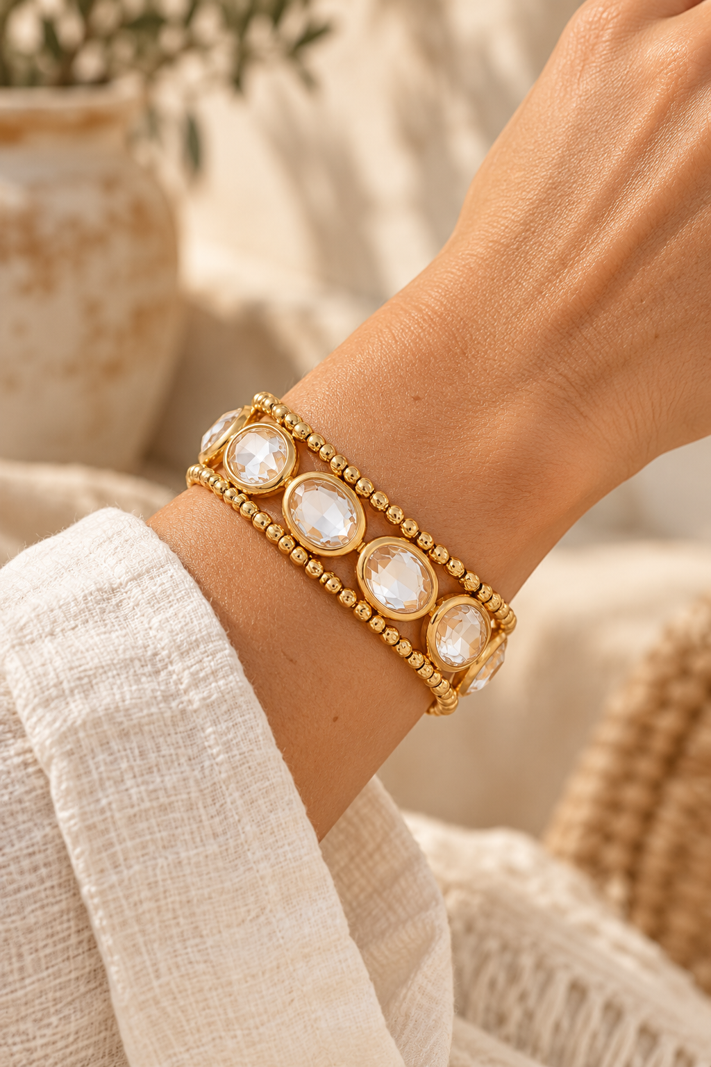 
                  
                    Oval Crystal Beaded Statement Bracelet – Clear worn on model wrist – AI styling illustration
                  
                