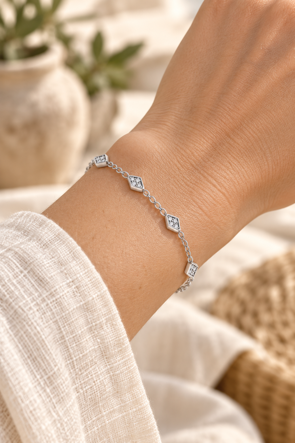 Rhombus Cubic Zirconia Chain Bracelet – Silver worn on model wrist – AI styling illustration