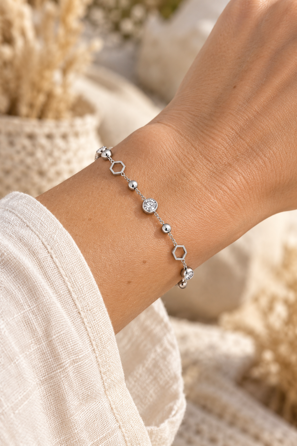 Crystal & Hexagon Waterproof Bracelet – Silver worn on model wrist – AI styling illustration