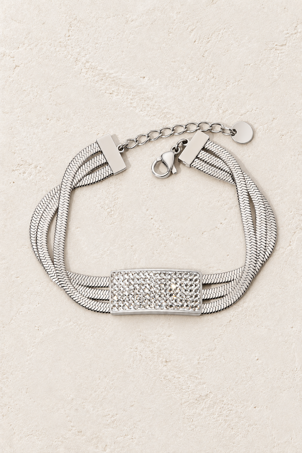 
                  
                    Luxe Pavé Bar Silver Snake Chain Bracelet on ivory textured background
                  
                