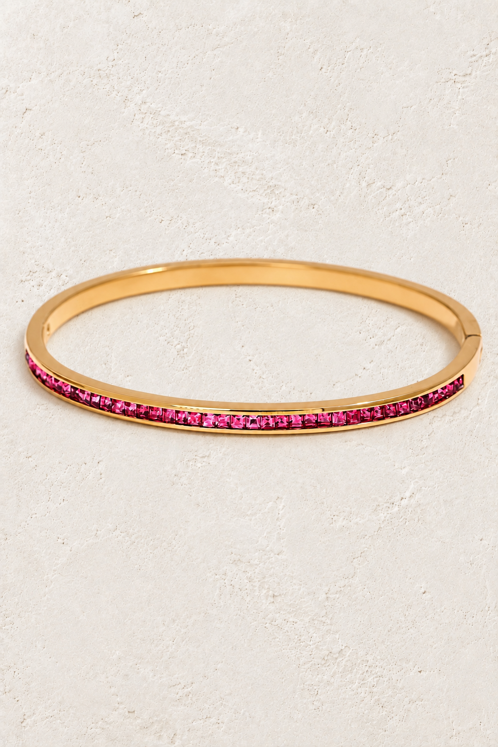 
                  
                    Serene Gold Pink Crystal Bangle on ivory textured background
                  
                