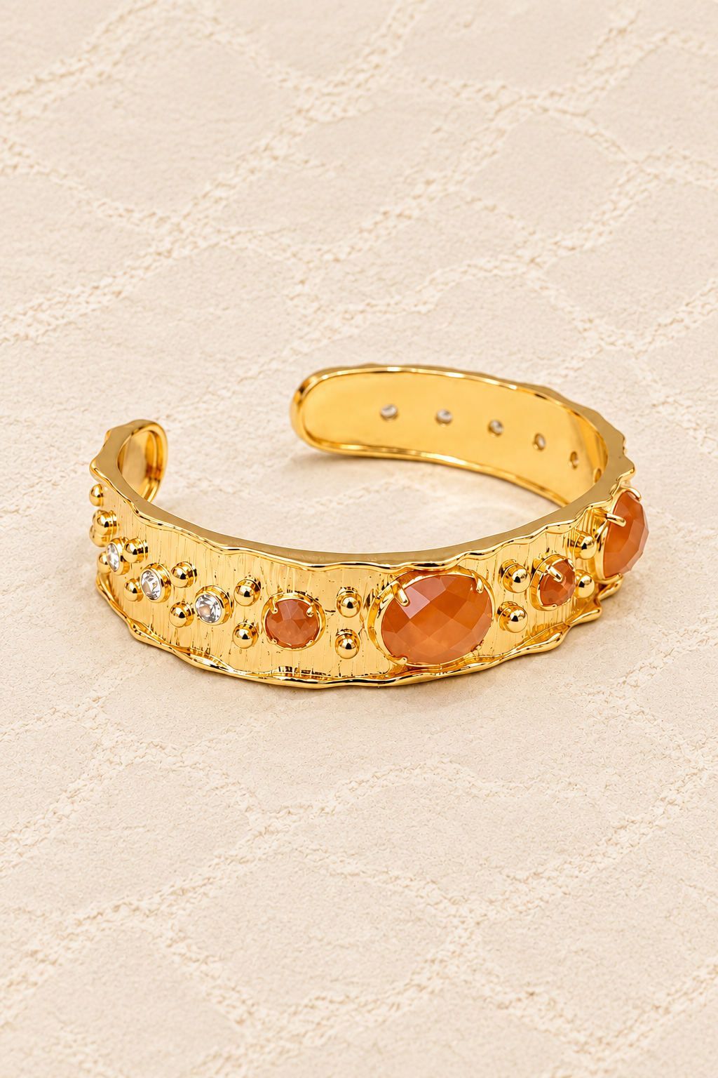 Sunstone Solara Cuff Bracelet on ivory plaster, tall product cover