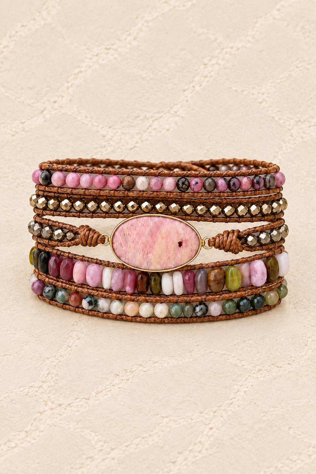 Handmade Rhodonite Mixed Natural Stone Wrap Bracelet on ivory plaster, tall product cover