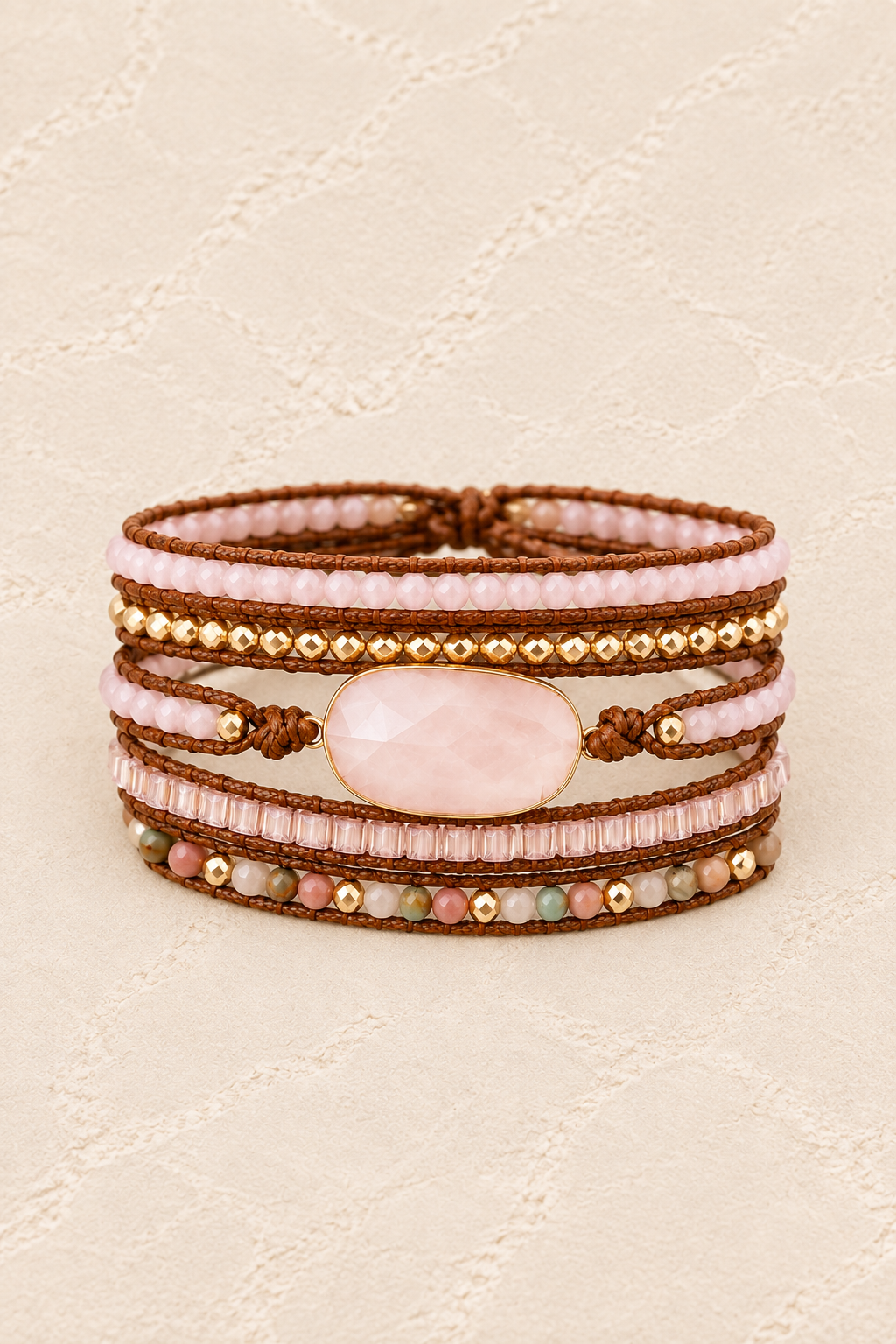 Handmade Rose Quartz Mixed Natural Stone Wrap Bracelet on ivory plaster, tall product cover