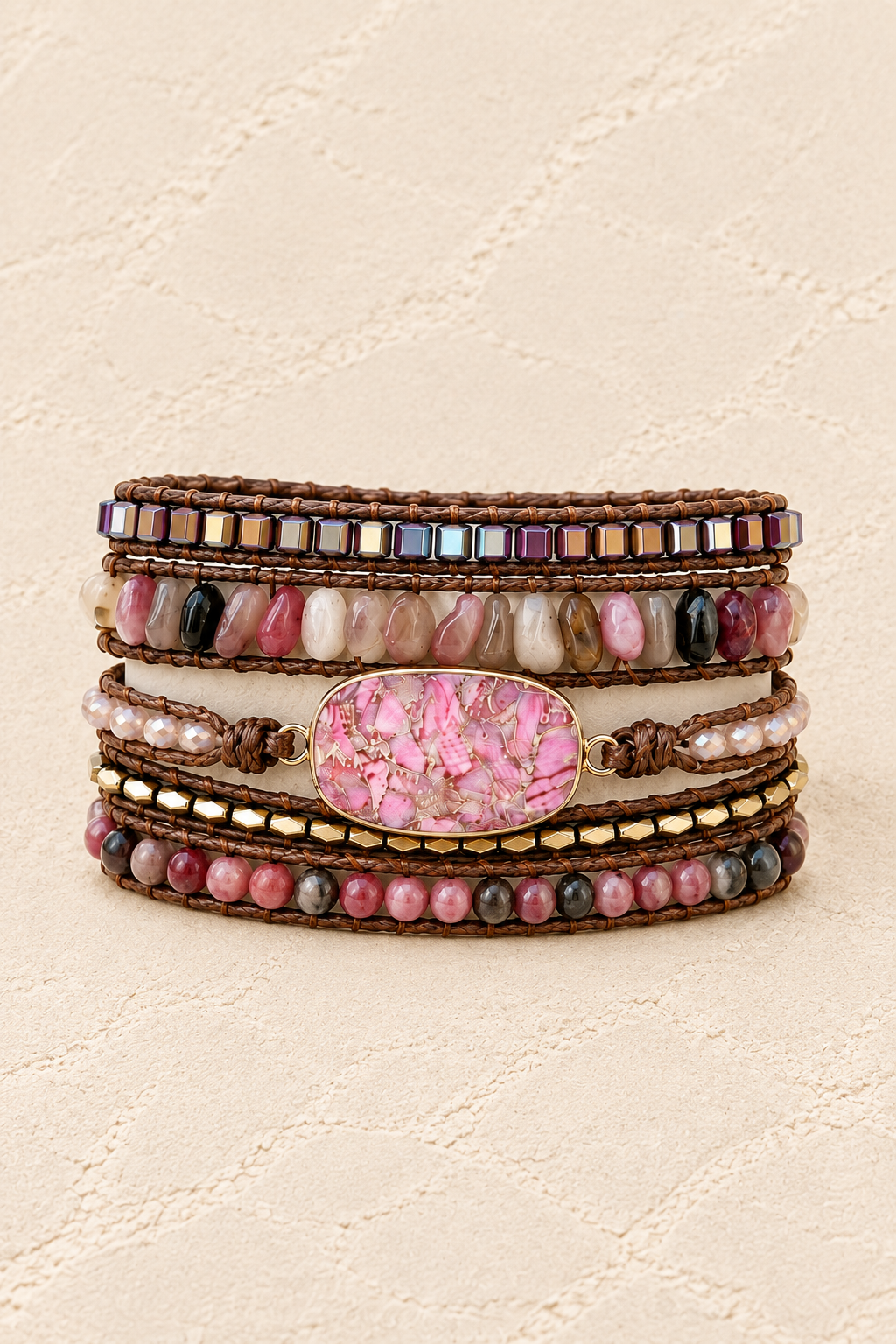 Handmade Pink Rhodonite Mixed Natural Stone Wrap Bracelet on ivory plaster, tall product cover