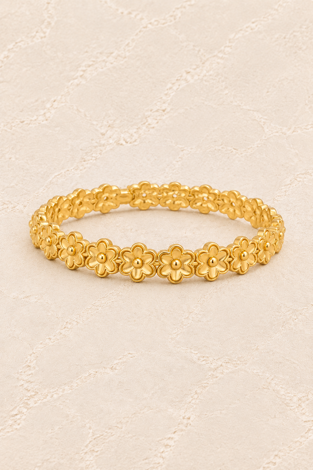 Golden Blossom Floral Link Gold Bracelet on ivory plaster, tall product cover